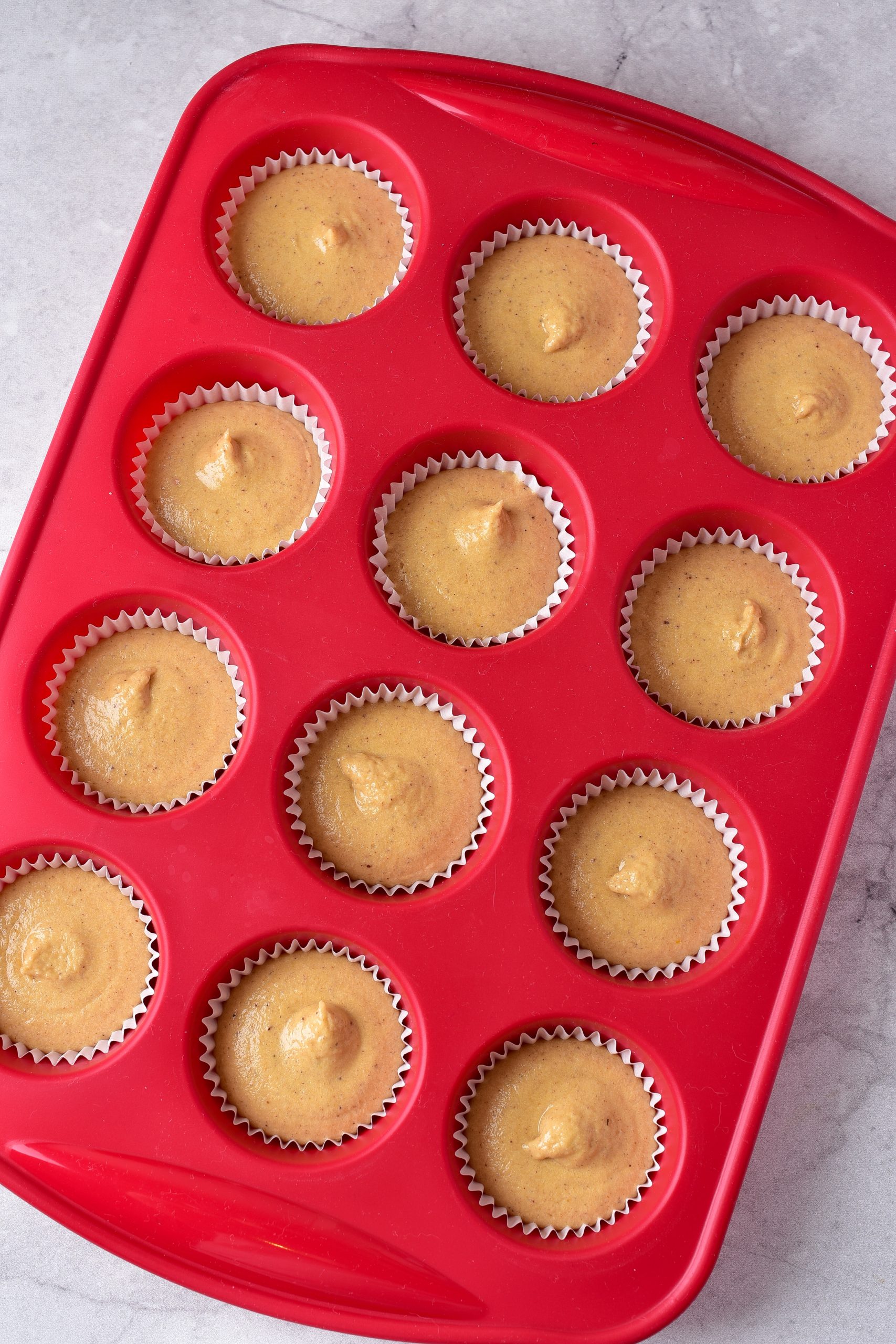 Place the batter by the tablespoon into the sections of a well-greased mini muffin tin. 