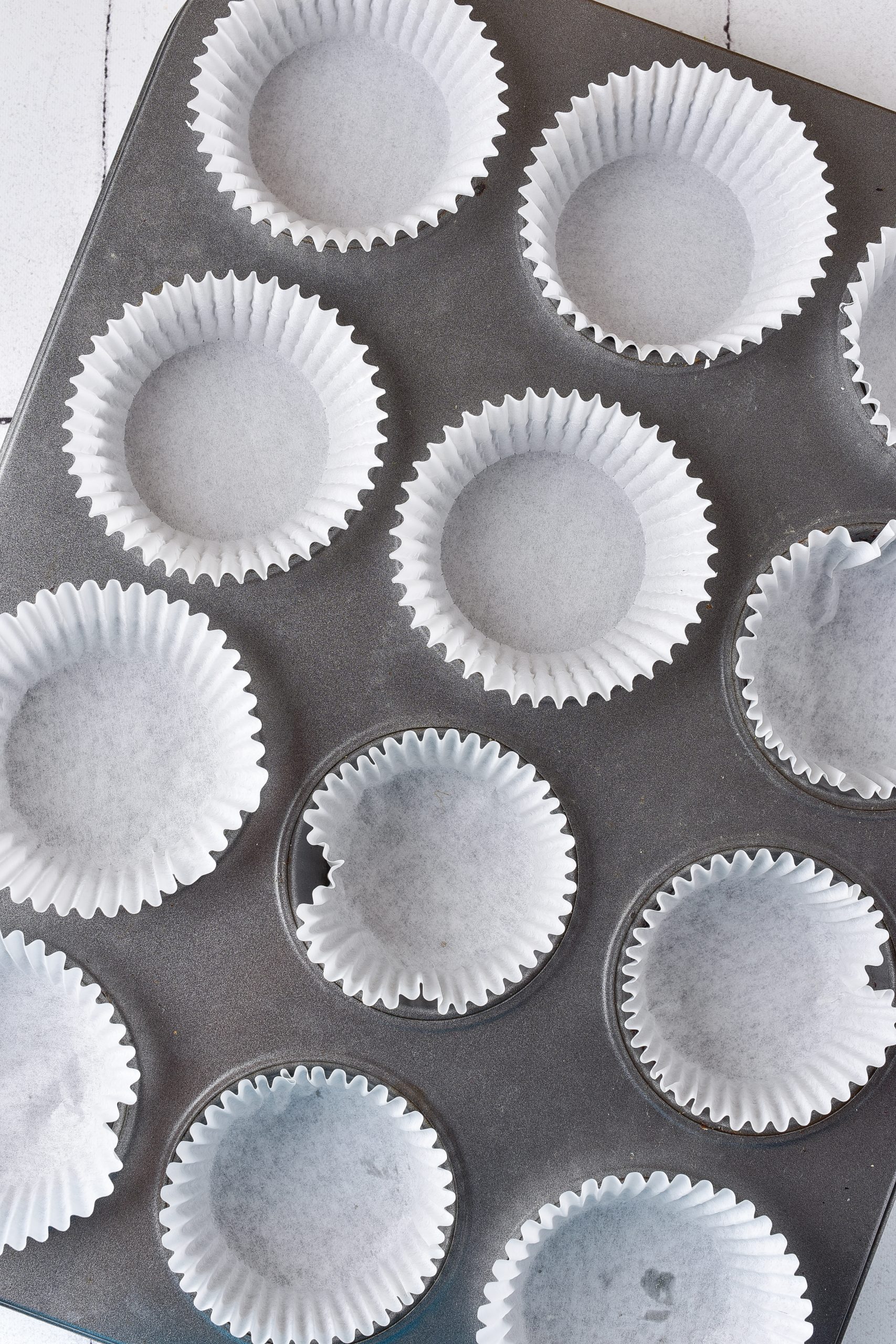 Heat the oven to 350 degrees, and line two muffin tins with cupcake liners. 