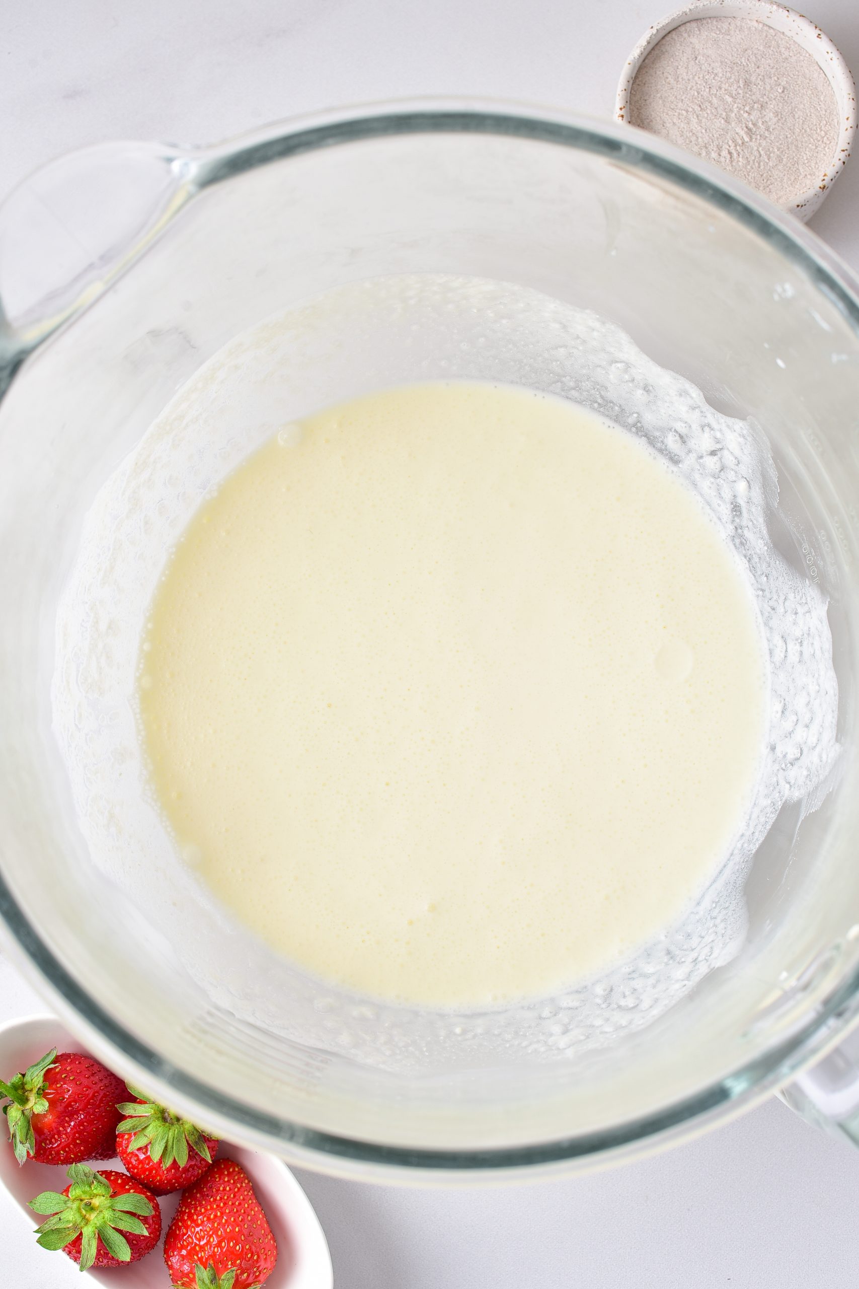 In a mixing bowl, blend together the cream cheese until fluffy. 