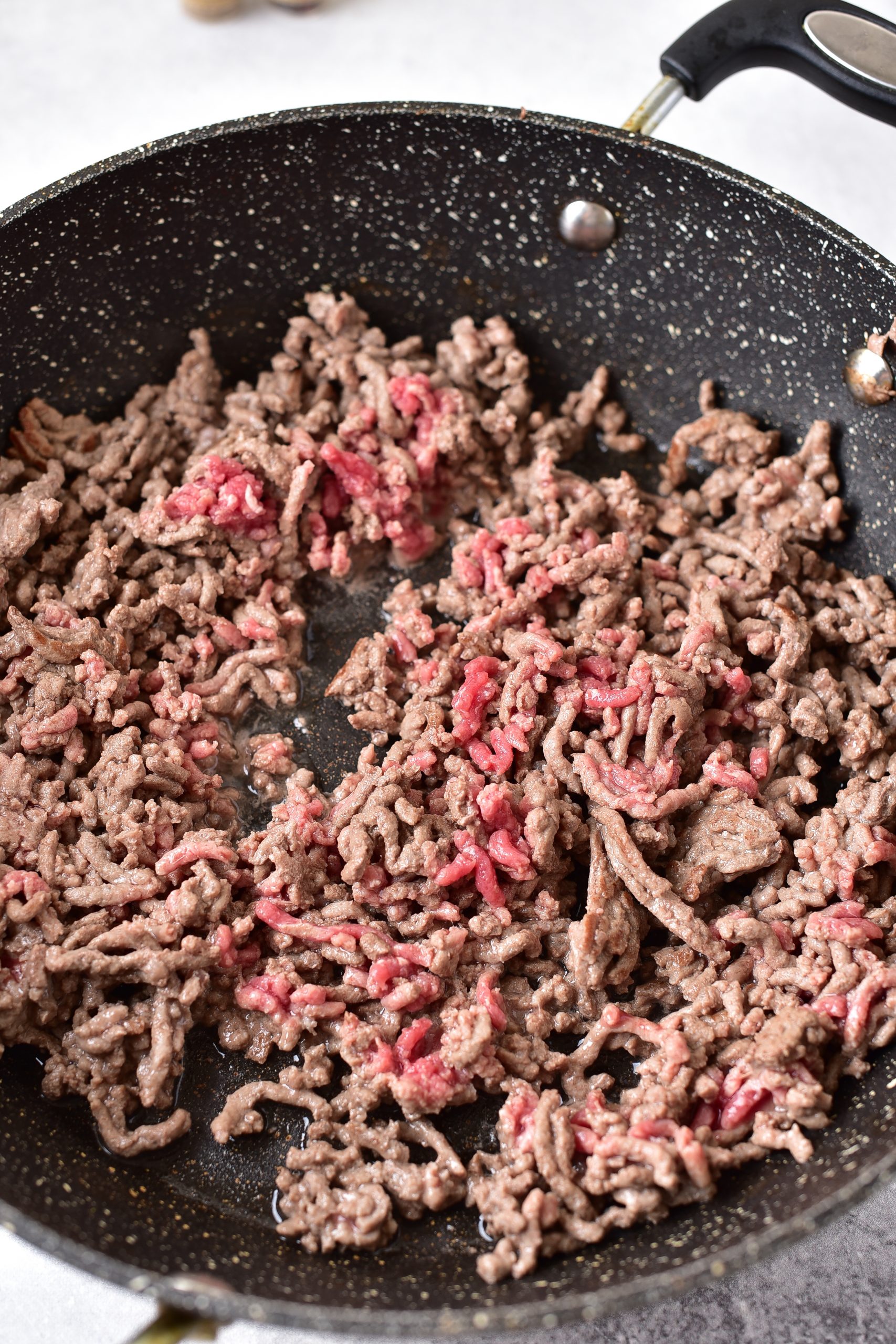 Place the ground beef in a skillet, and saute until completely browned. 