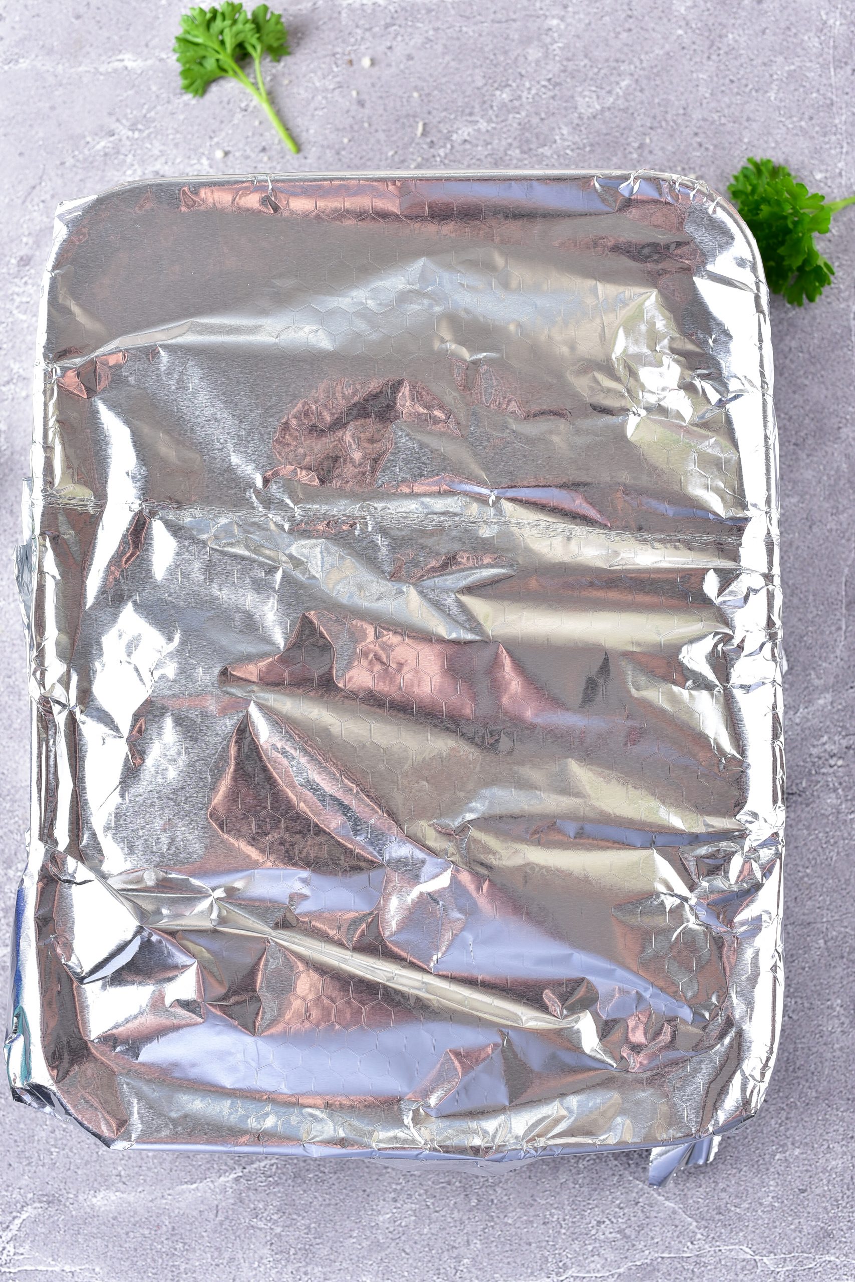 Tent a piece of tin foil over the baking sheet, and bake covered for 30 minutes. 