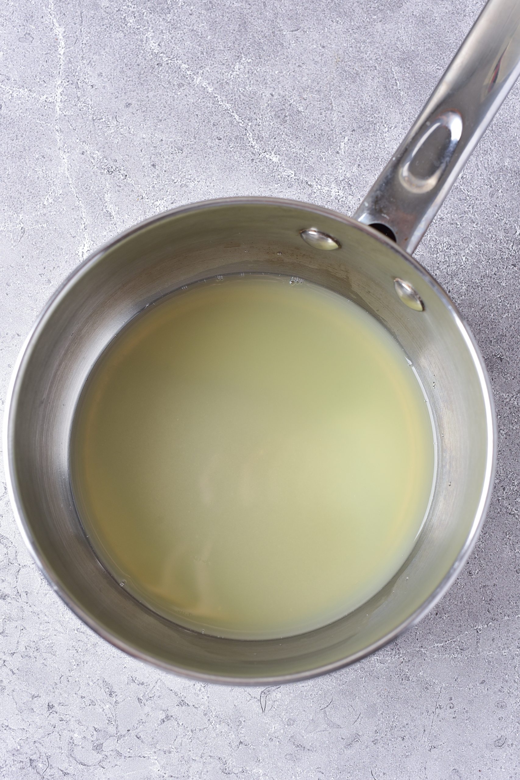 Place the ingredients for the syrup into a saucepan over medium heat. Simmer until the sugar has melted. 