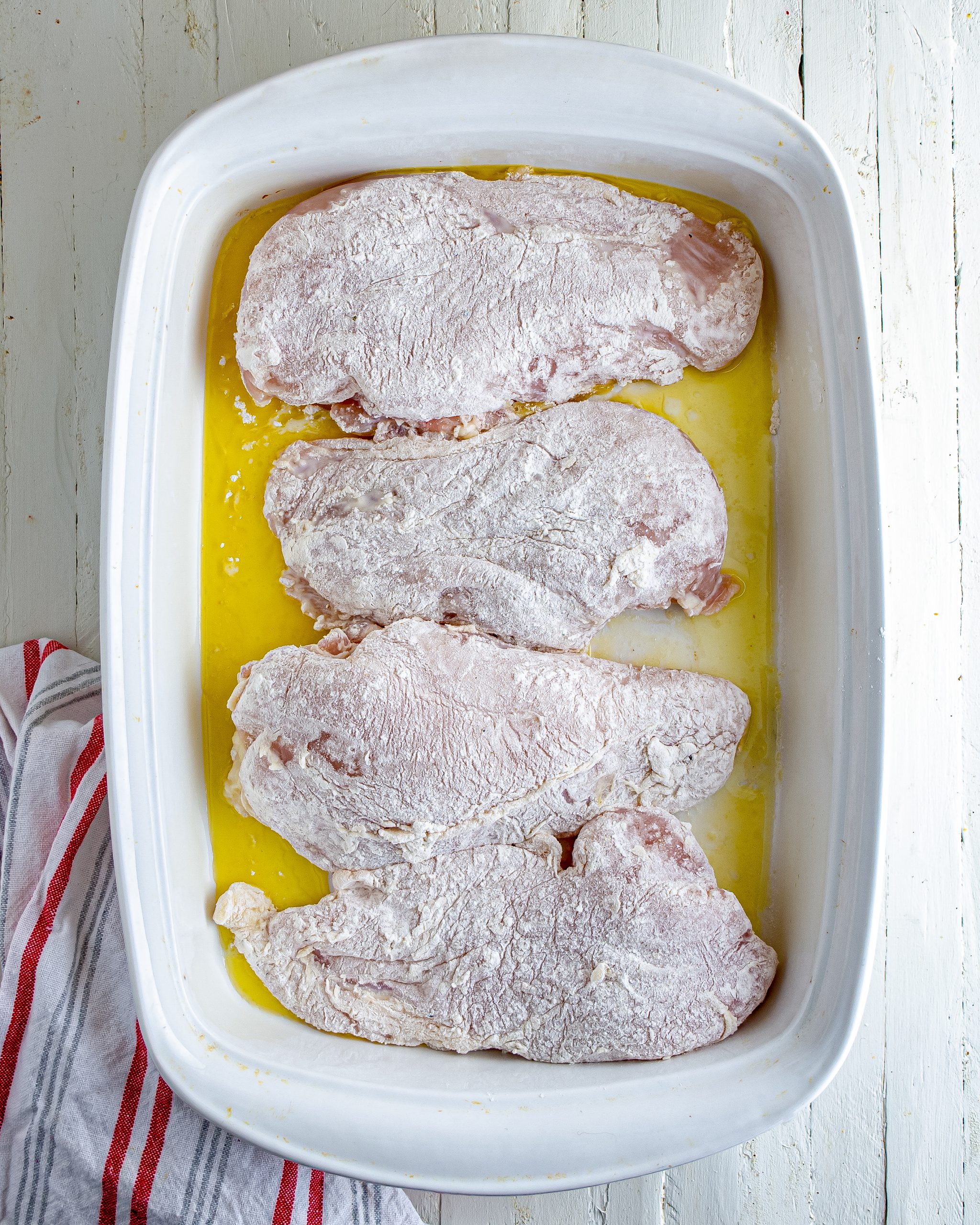 Layer the chicken in the baking dish.