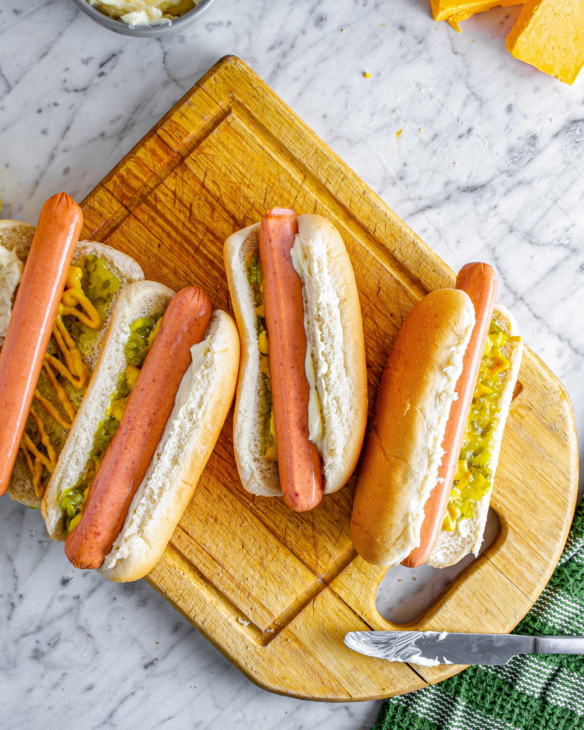 Place the hot dogs in the buns.