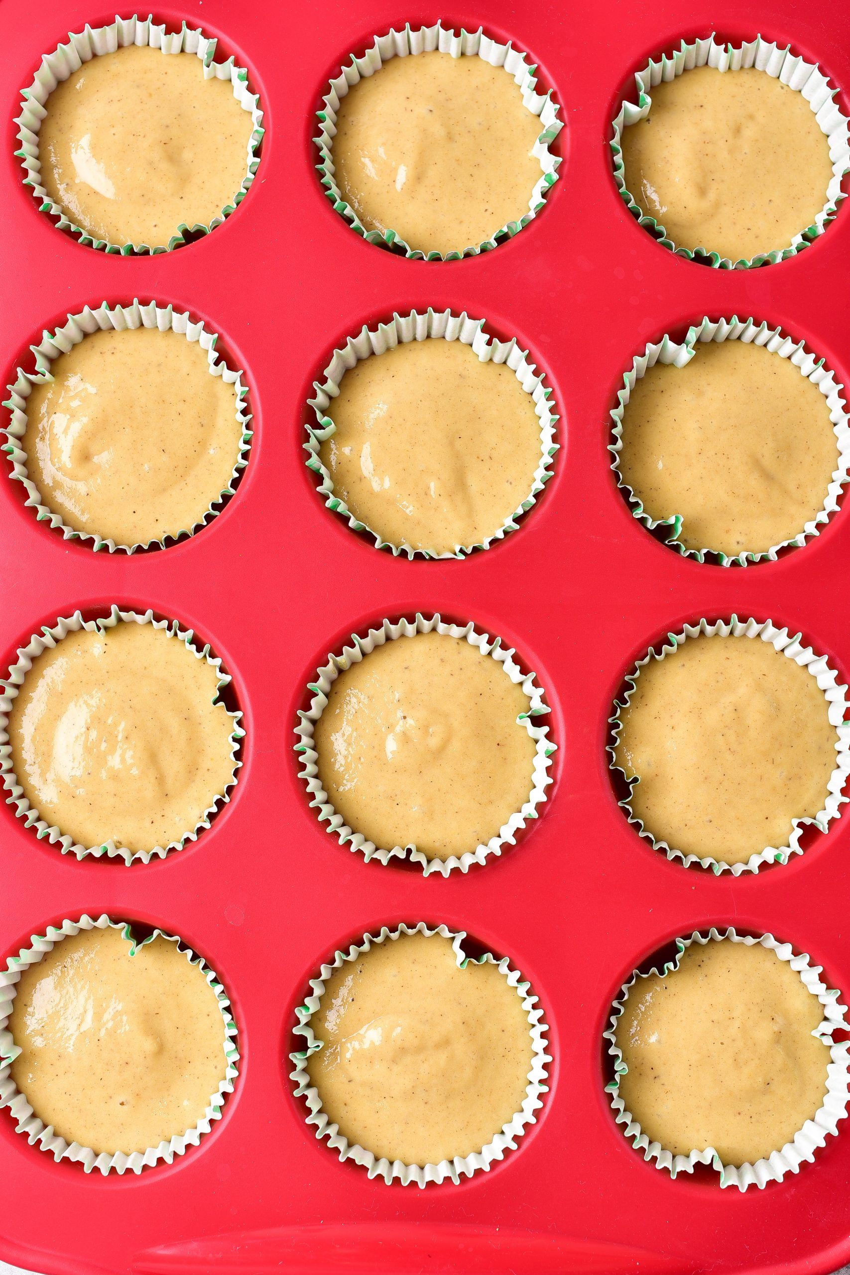 Spread the batter into the cupcake liners in the muffin tin. 