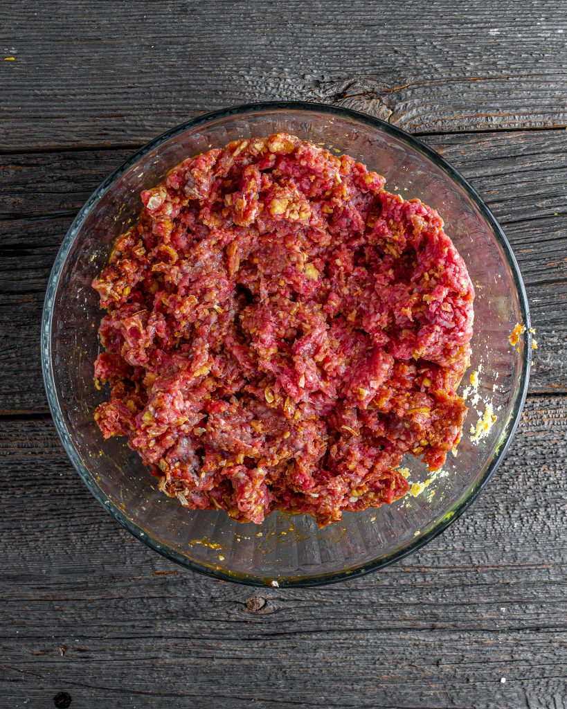 Add the ground beef to a separate large mixing bowl. 