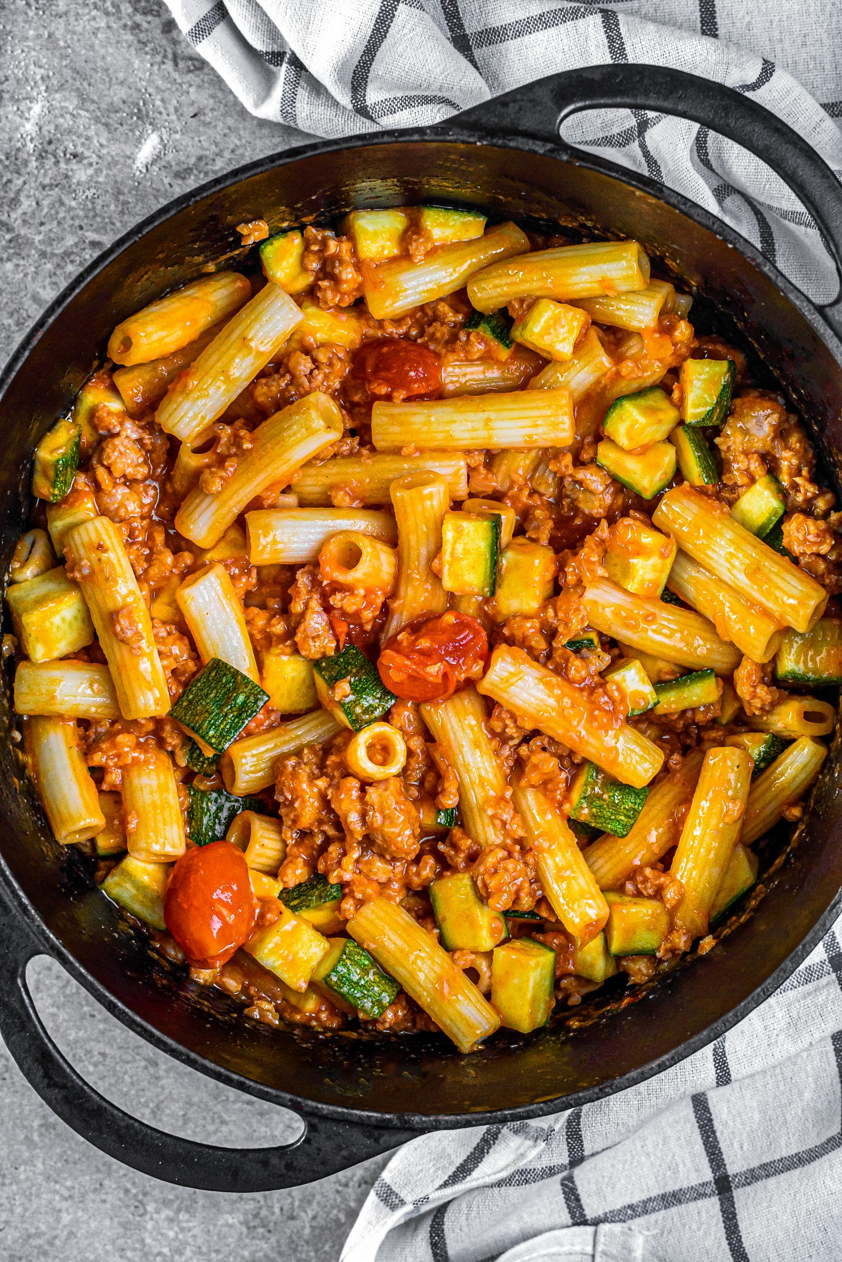 Mix the pasta into the skillet, and toss to combine the ingredients well. Add some of the reserved pasta water if needed.