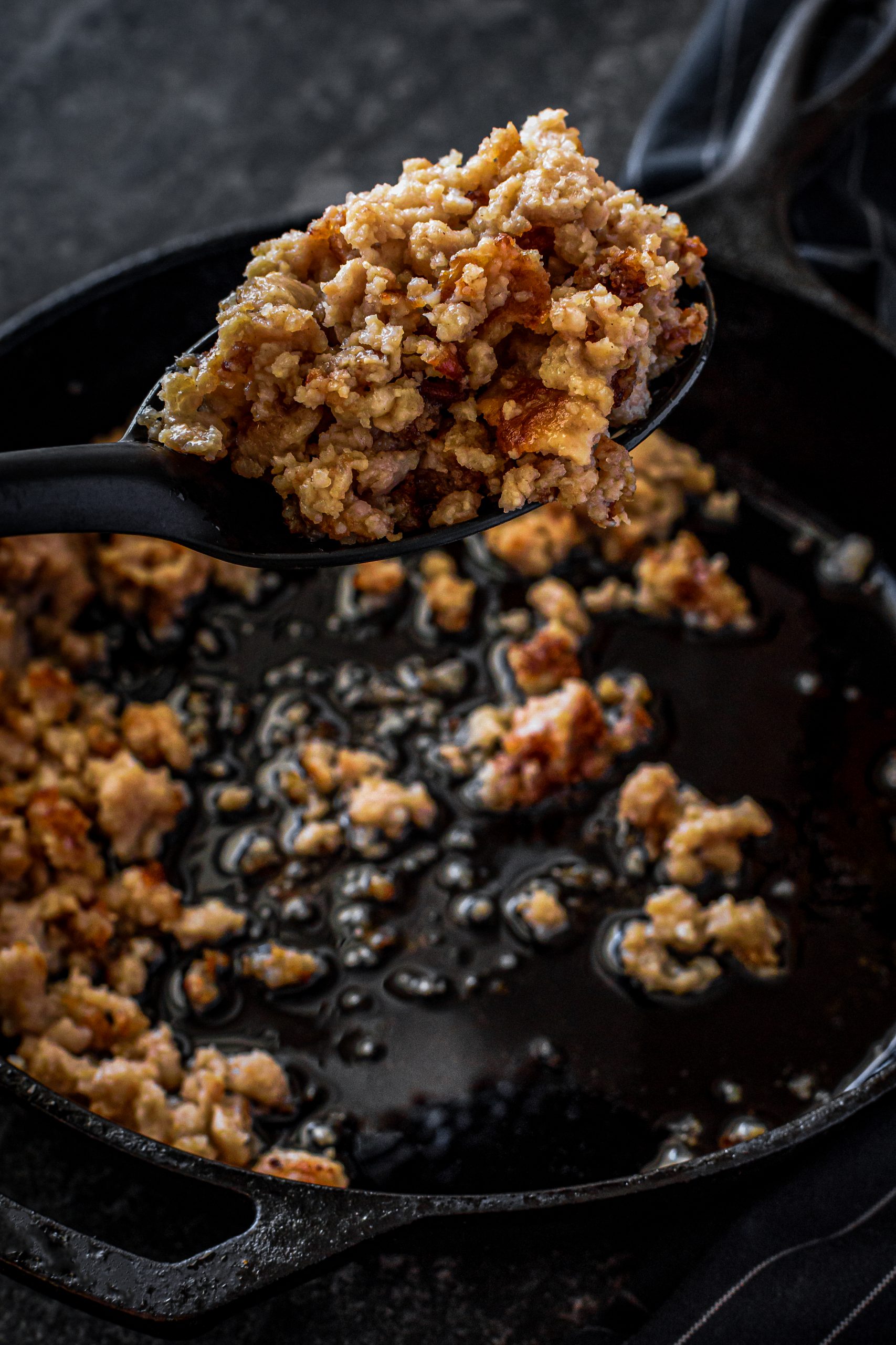 Add the sausage to a skillet over medium-high heat, and cook until crumbled and fully browned. Drain the excess grease. 