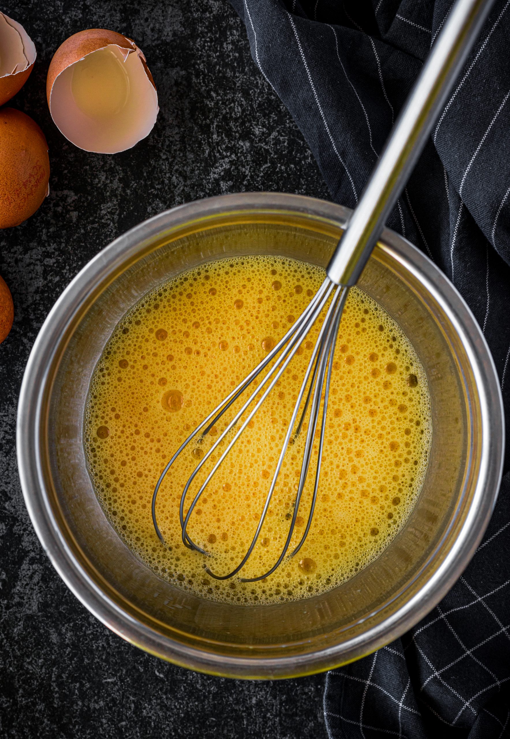 Whisk together the eggs, Bisquick mix, and cheese in a large mixing bowl. 