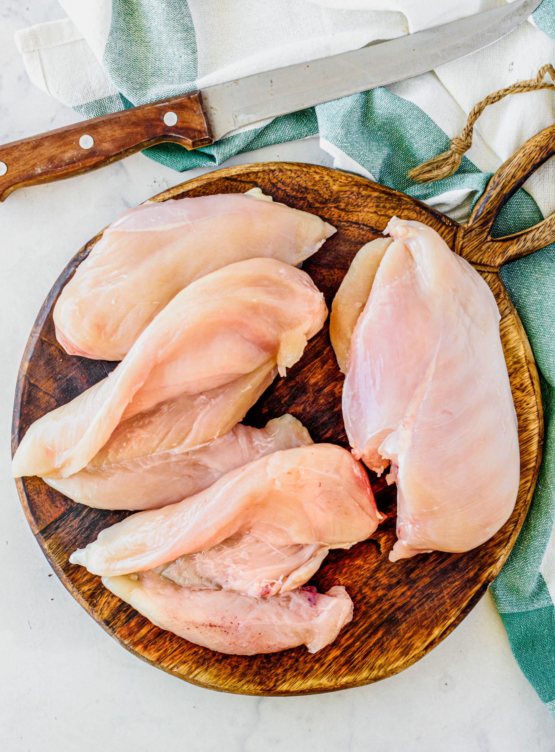Slice a pocket into the side of each chicken breast.