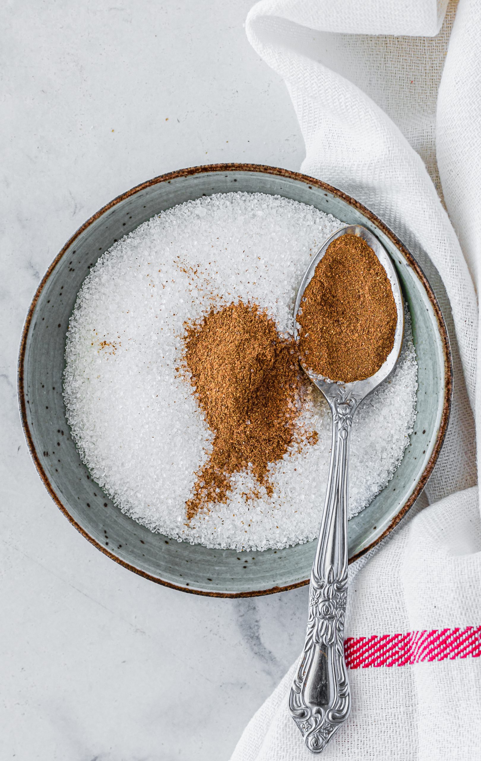 Mix together the sugar and cinnamon for the topping in a separate bowl. 